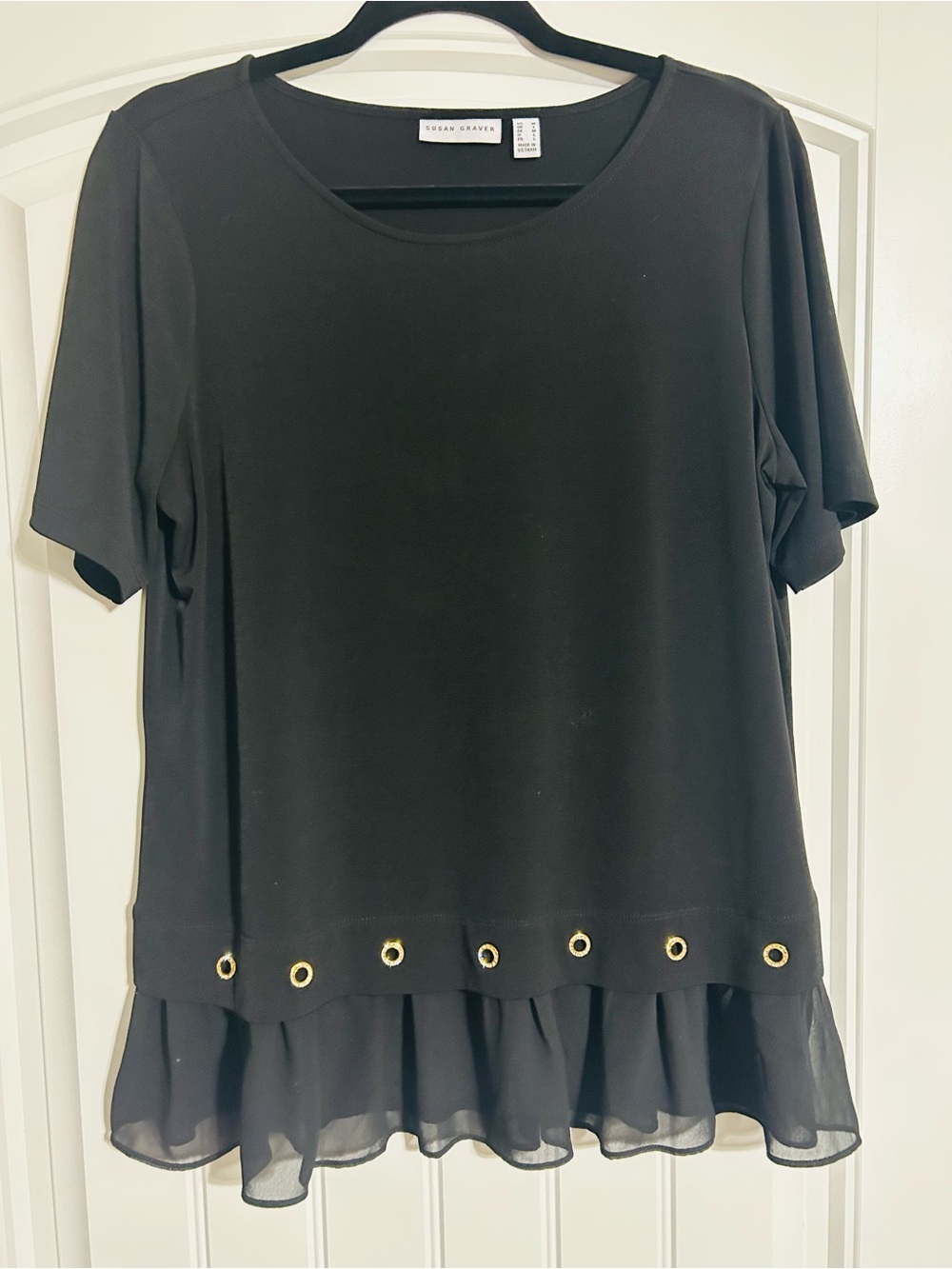 Susan Graver Black Short-Sleeve Top with Gold Grommet Trim and Ruffle Hem